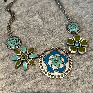 Cute statement necklace.  Pewter look with enamel accents.